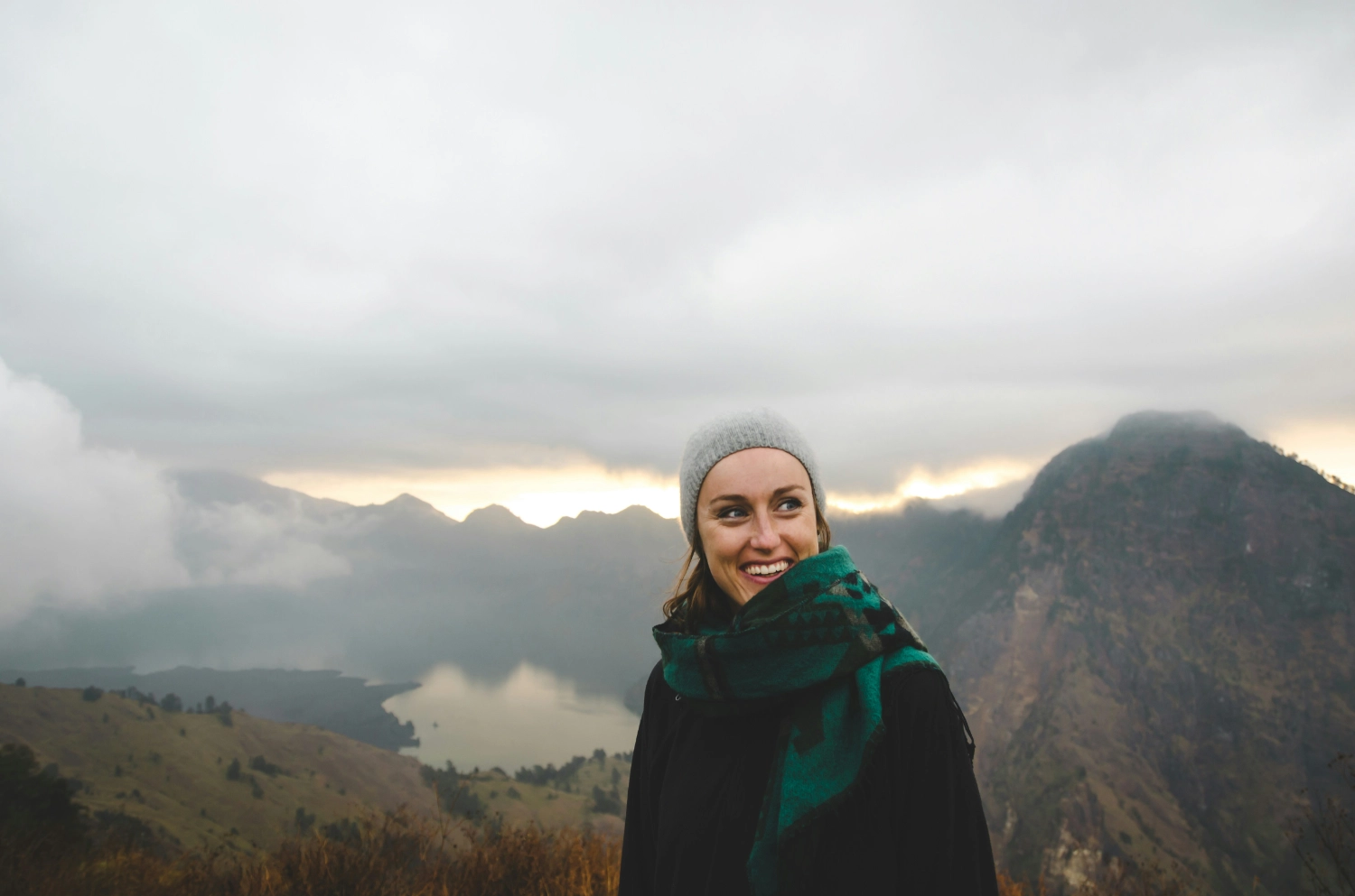 smiling woman hiking in mountains