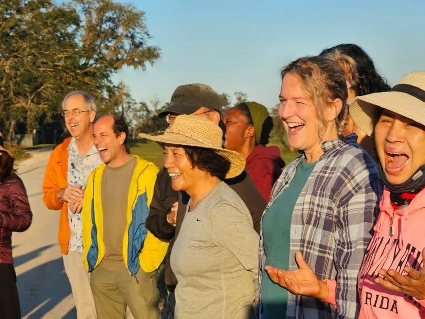 people laughing in the sun